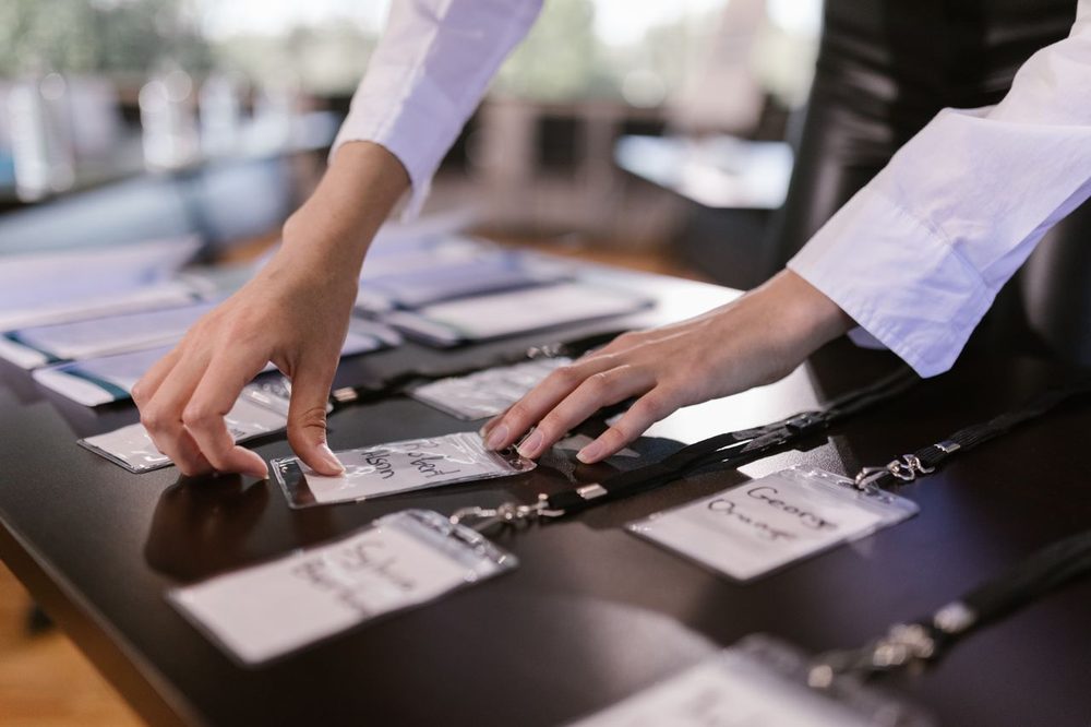 Event staff arranging guest name badges on-site